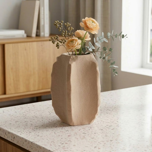 Beige ceramic decorative flower vase placed on kitchen counter with flowers modern home interior styling idea.