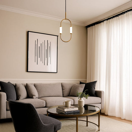Modern brass pendant light with white cylindrical shades hanging elegantly in contemporary home interior decor setting.