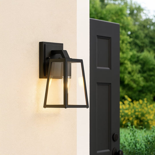 Elegant black metal wall lantern with clear glass panels styled for outdoor entry lighting adding modern charm to home exteriors.