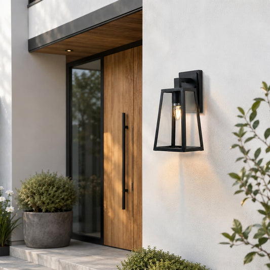 Black metal outdoor wall light lifestyle image beside wooden entry door for elegant exterior lighting decor.