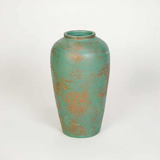White background image of green ceramic decorative vase for elegant tabletop decor styling with textured finish.