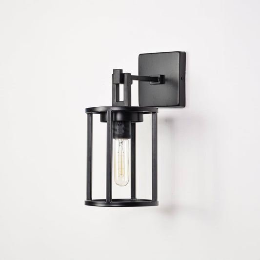 Black metal outdoor wall light on white background with clear glass shade for modern patio wall decor.