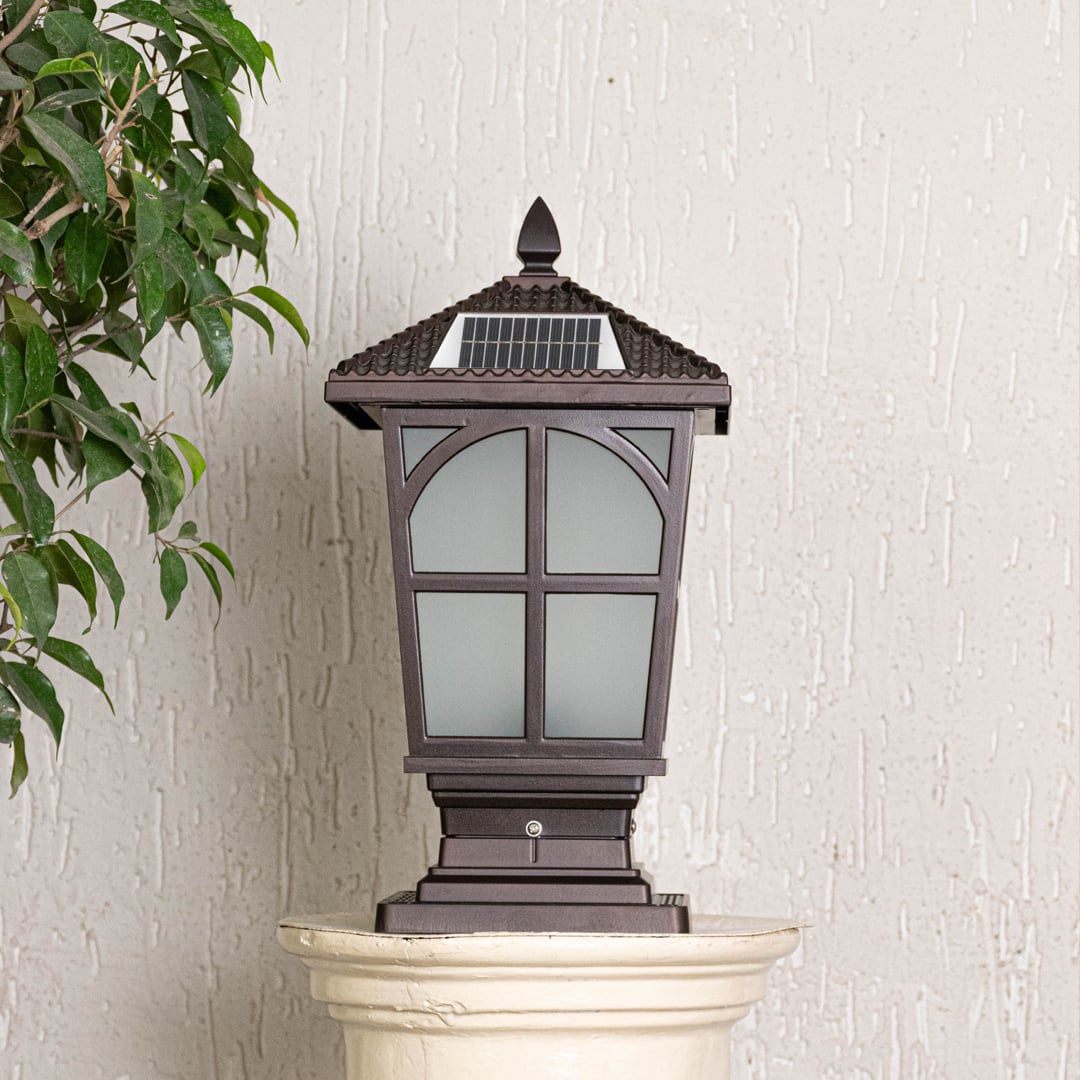 Outdoor post lantern in black metal with frosted glass panels displayed on white background highlighting classic garden lighting design.