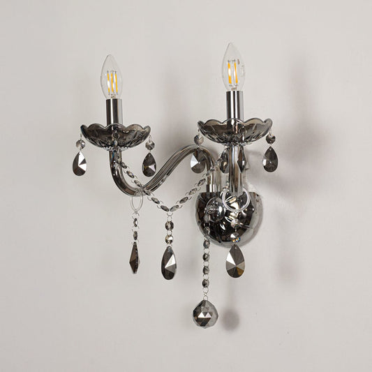 Wall light with chrome metal frame and dark crystal accents displayed on a white background for clear refined product detail.
