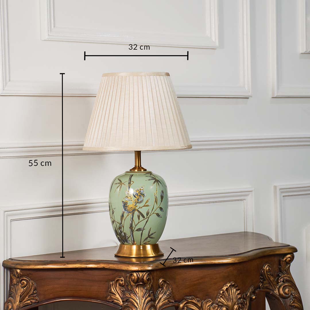Green floral table lamp with beige pleated shade measuring 55 cm in height and 32 cm in width ideal for bedroom or living room.