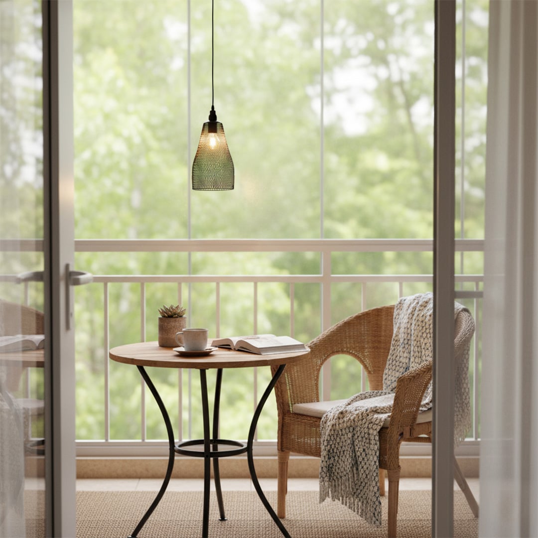 Amber ribbed glass pendant light above cafe table creating warm ambient lighting for modern indoor seating areas.