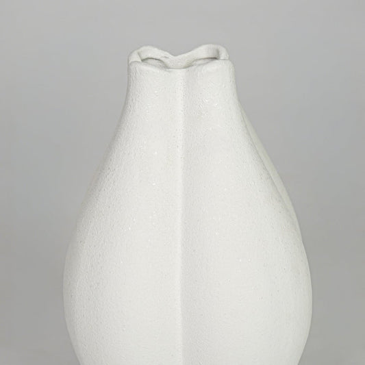 Closeup white smooth ceramic vase texture detail modern decorative flower vase for table shelf console decor.