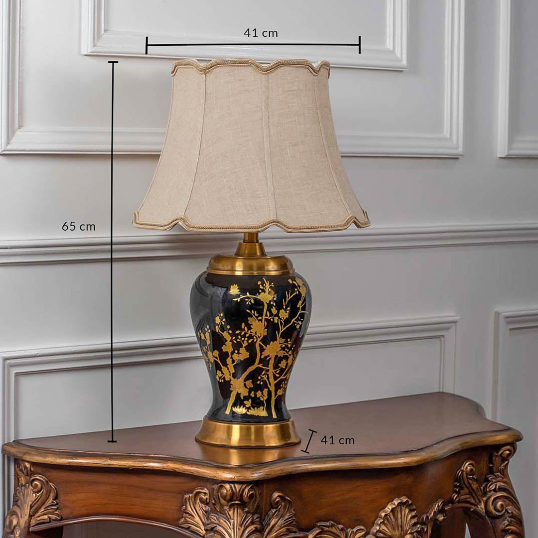 Luxury black and gold ceramic table lamp with beige fabric shade displayed on white background featuring height 65 cm and width 41 cm for accurate size reference.
