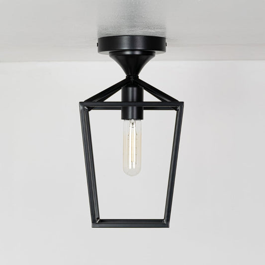Outdoor black metal ceiling lantern with clear inner glass shown with lights off on a white background emphasizing its open frame design.
