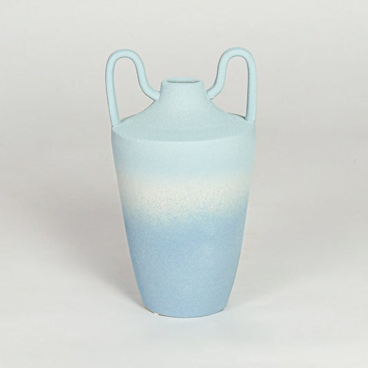 Modern light blue ceramic decorative vase with elegant curved handles and tapered silhouette for home styling.