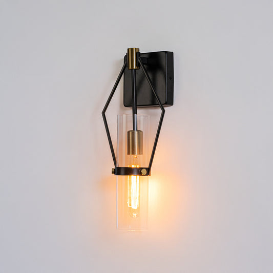 Industrial wall light in black metal finish with geometric frame and bulb for bedroom or living decor lighting white background.