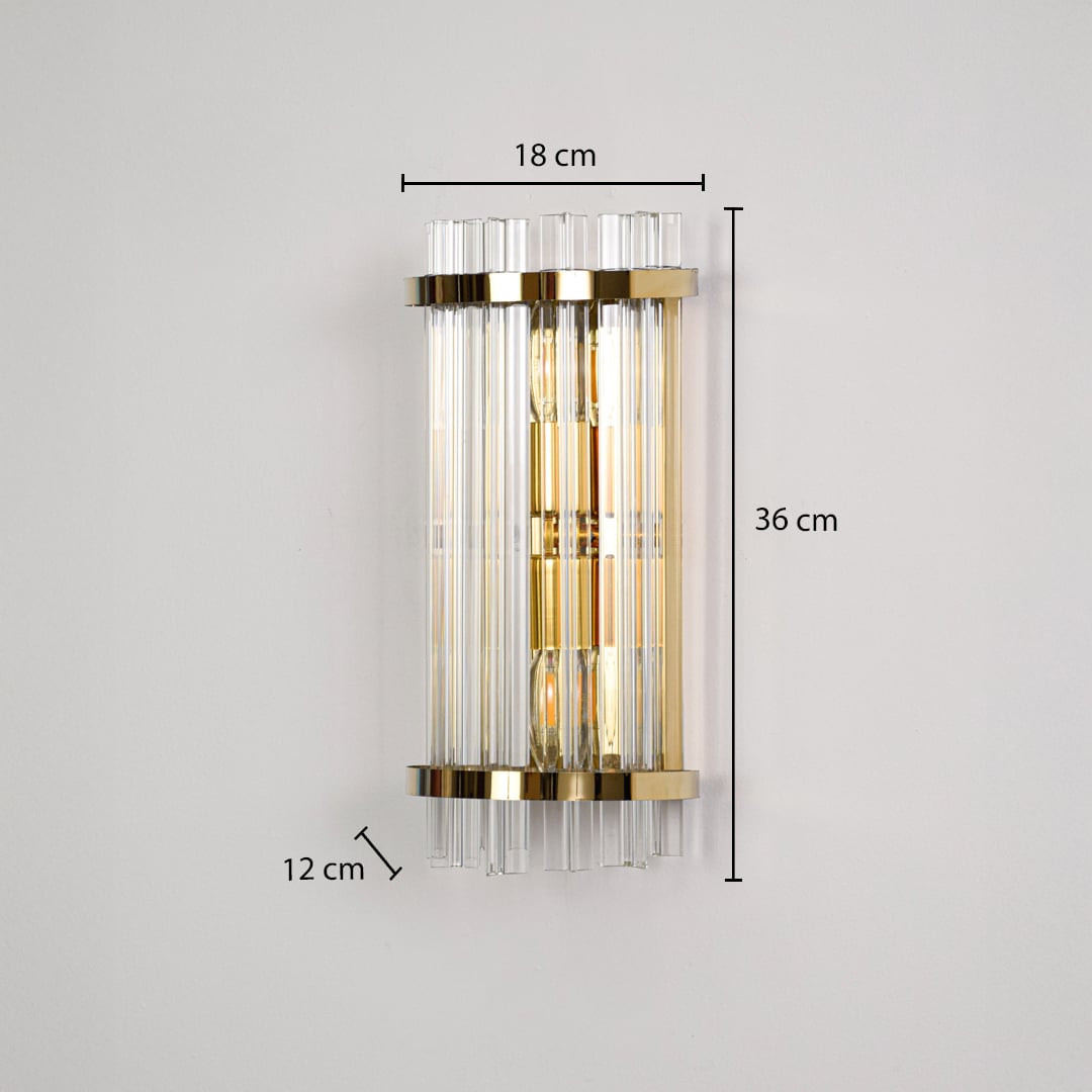 A gold crystal wall light displayed on a black background showing dimensions 18 cm width 36 cm height and 12 cm depth.