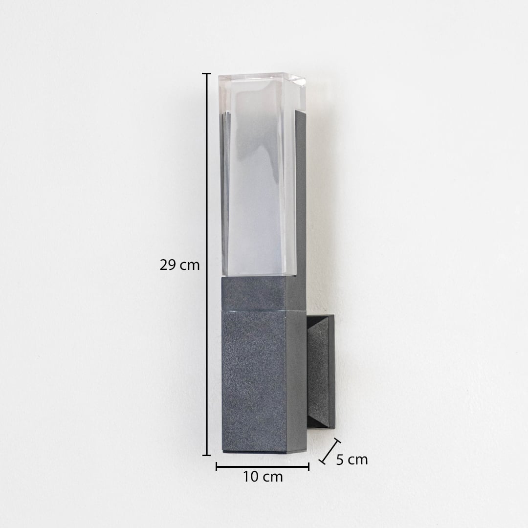 Modern outdoor wall light in metal and glass finish mounted on wall showing 29 cm height 10 cm width and 5 cm projection.