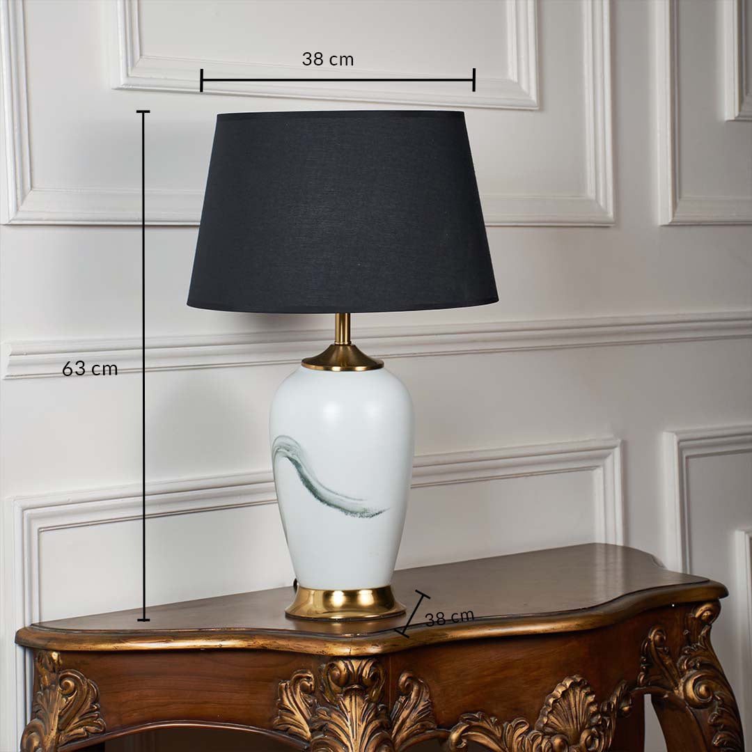 White ceramic table lamp shown with 63 cm height 38 cm shade width and 38 cm base width on a carved wooden console for accurate size reference.