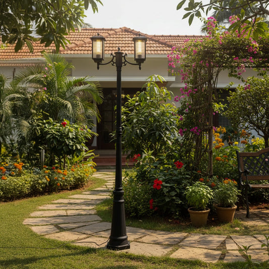 Outdoor garden post light in black metal placed along stone pathway creating soft illumination and refined charm for landscaped home exterior.