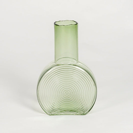 round geometric shape glass vase green white background