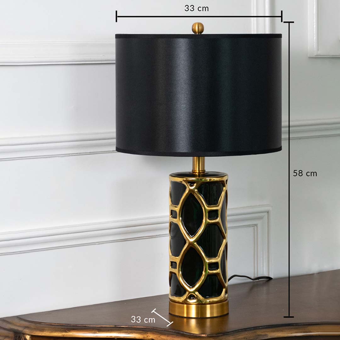 Black and gold ceramic table lamp with fabric shade shown with 58 cm height and 33 cm width for elegant decor detailing.