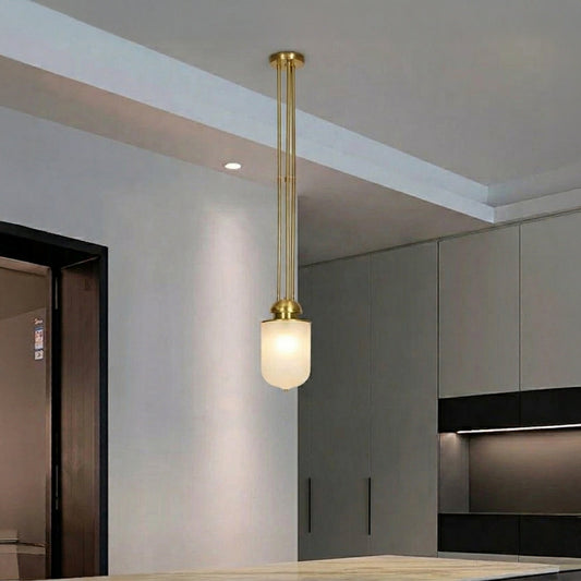Black metal and white glass pendant light adding warm elegance to modern kitchen interiors.