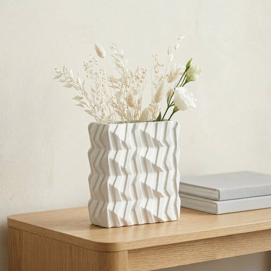 White ceramic decorative vase placed on wooden table modern flower vase for living room shelf decor styling.