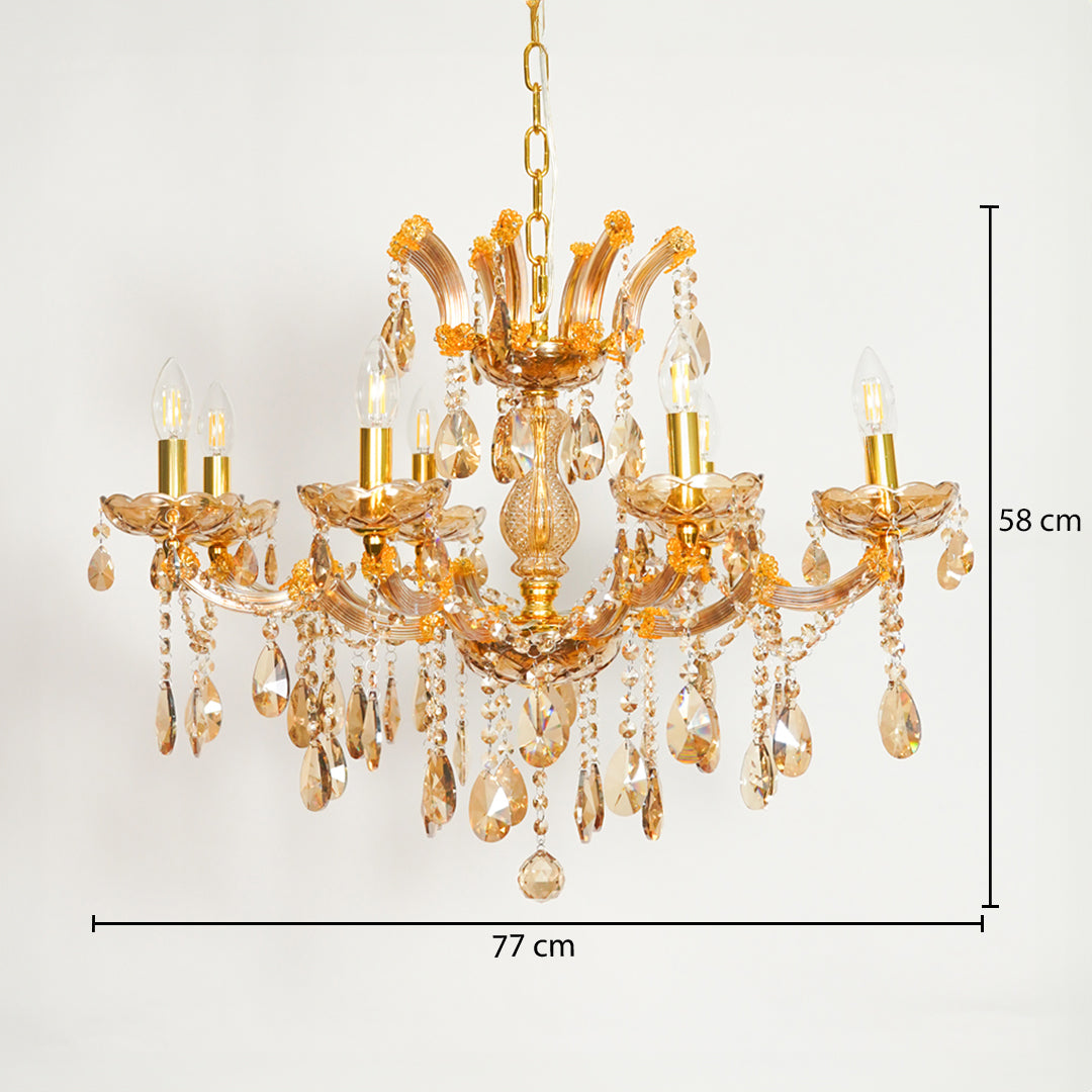 A gold-finished multi-light chandelier with clear glass teardrop crystals, shown against a plain white background with dimension lines indicating 77 cm width and 58 cm height.