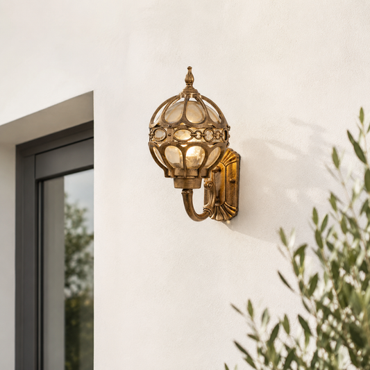 Antique brass aluminum globe outdoor wall sconce light with ornate filigree pattern for luxury villa exterior decoration.