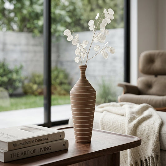 Brown ceramic decorative flower vase placed on wooden table with dried flowers modern living room home decor styling idea.