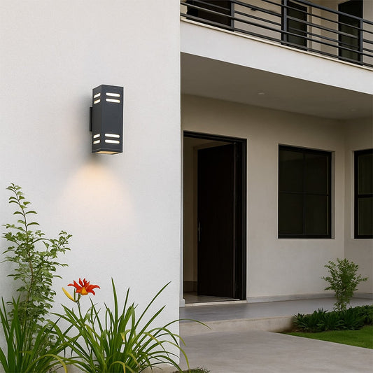 Modern rectangular black wall light illuminating an exterior wall with sleek linear glow and stylish minimal design.