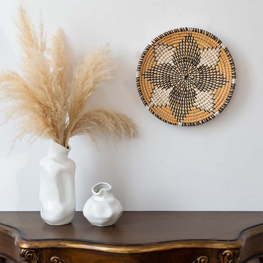 Handwoven wall basket used as boho wall decor in living room with rustic natural style and modern vase