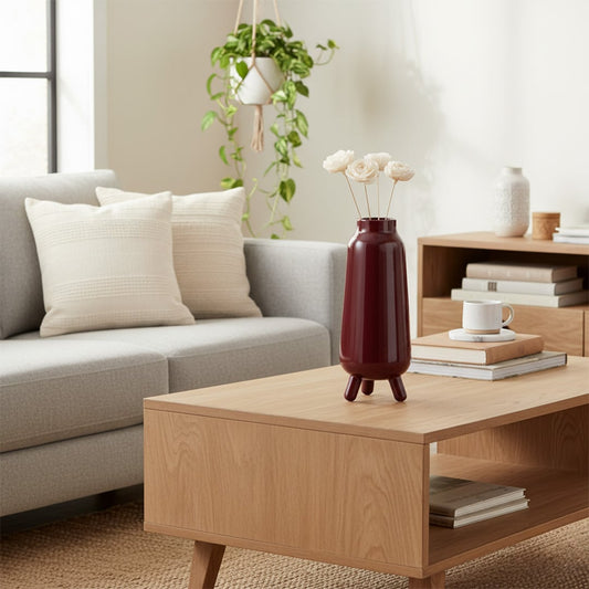 Modern living room with red decorative vase on coffee table adding bold accent and elegant touch to interior Decor.