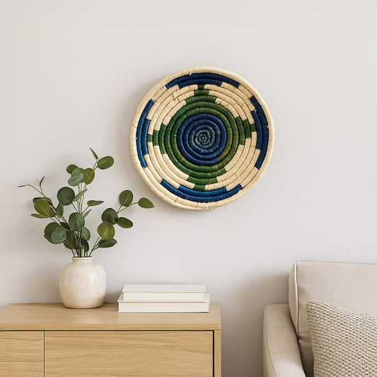 Decorative woven wall basket styled above console with plant and books adding natural warmth to modern interior Decor space.