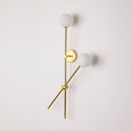 Wall light turned off on white background showcasing clean metal lines frosted glass globes and minimalist vertical design.