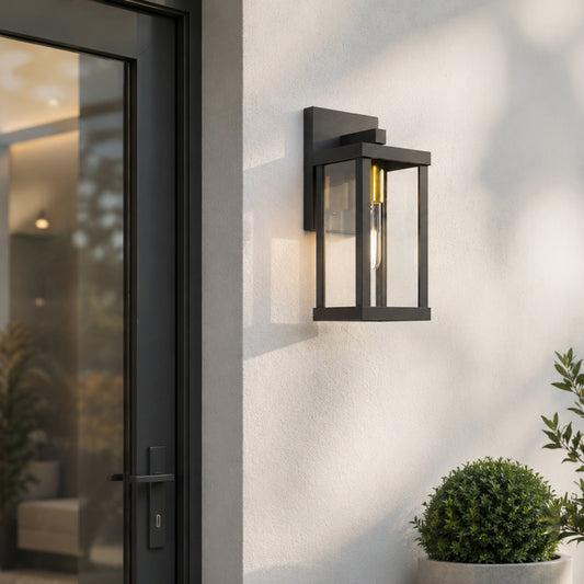 Black metal outdoor wall light lifestyle image with warm glow for elegant exterior entryway decor.