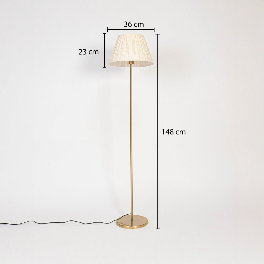 Floor lamp dimensions image showing 148 cm height with 36 cm wide and 23 cm tall white pleated shade on golden stand.