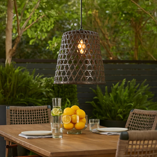 Woven black bamboo pendant light adding artistic texture and warm glow to contemporary home interior spaces.