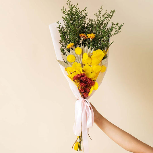 Sunshine mixed dried flowers bouquet displayed on white background showcasing warm tones preserved texture and cheerful home decor styling.