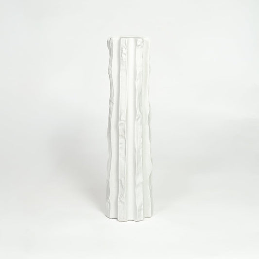 Modern white ceramic statement floor vase with minimalist textured finish for luxury home interiors.