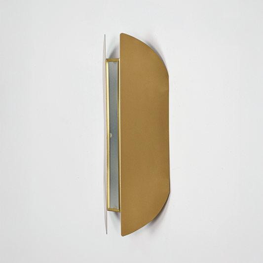 Wall light off on white background featuring slim gold metal body with modern curved profile for minimalist product display.