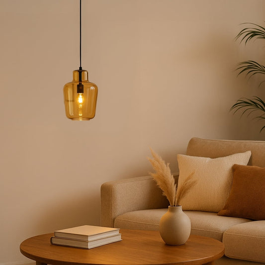 Modern amber glass pendant light styled in a warm interior setting with soft ambient glow creating an elegant decorative look