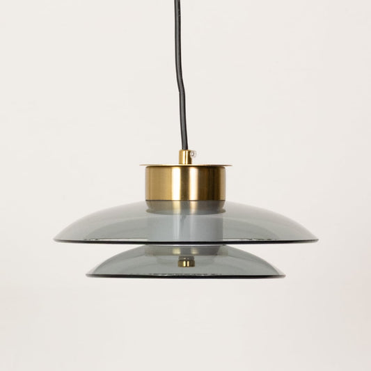 Pair of grey and amber pendant lights shown with lights off highlighting the layered glass design and contemporary round form.