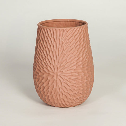 Modern green ceramic sculptural flower vase with twin openings isolated on white background for clean product display.