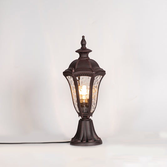 Vintage outdoor gate light with black metal frame and warm glass shade for elegant exterior decor use.