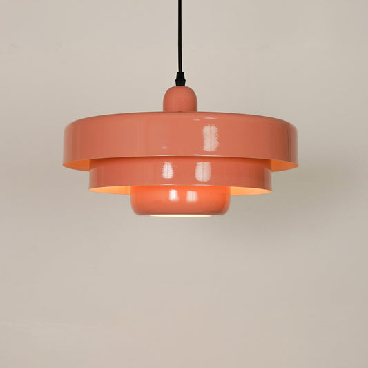 White background image of pink triple layer disc pendant light for elegant dining room styling with bright illumination.