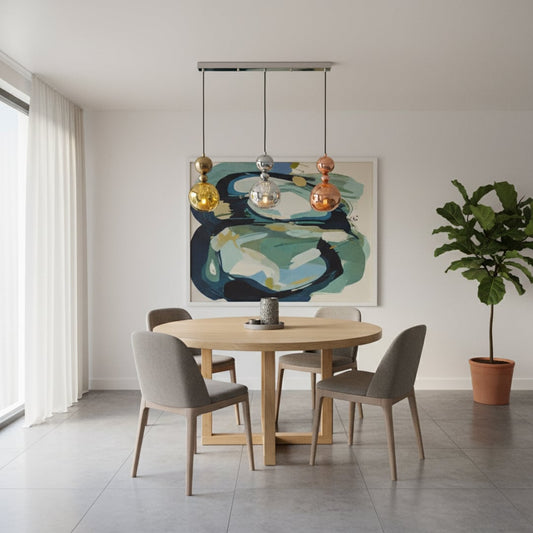 Modern metallic pendant trio with gold silver and copper sculpted shades hanging from a sleek silver bar creating a bold artistic focal point in the room.