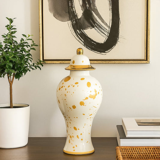 White ceramic jar with yellow detailing styled on console table adding classic charm and refined elegance to home Decor.
