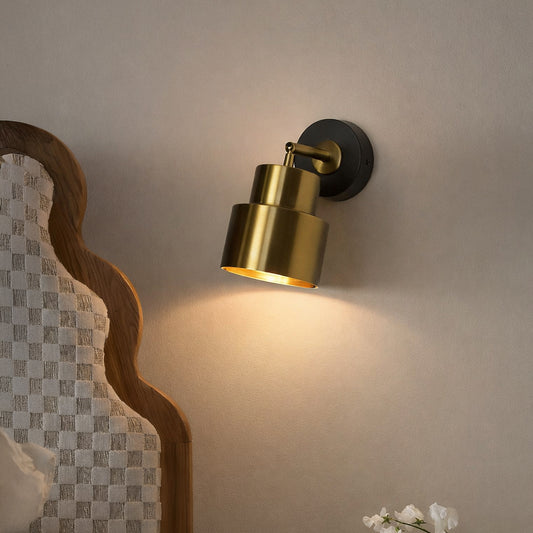 Gold metal wall spotlight with black base modern adjustable wall lamp for bedroom living room decor focused lighting.