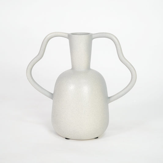 White ceramic vase with artistic handles for stylish console table placement and contemporary indoor decor styling.