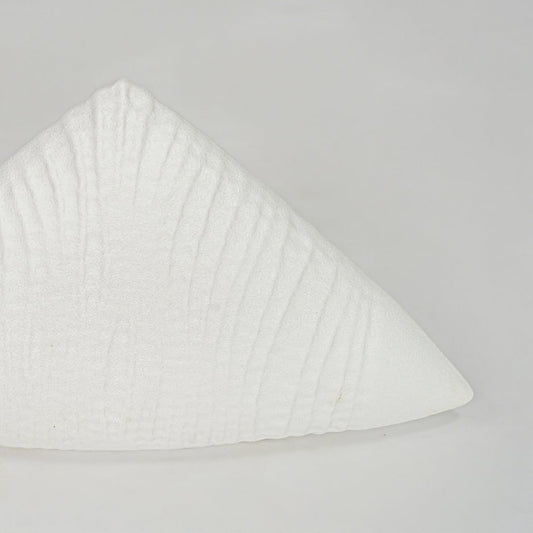 Closeup white textured ceramic decor piece surface detail modern decorative object for table shelf console decor.