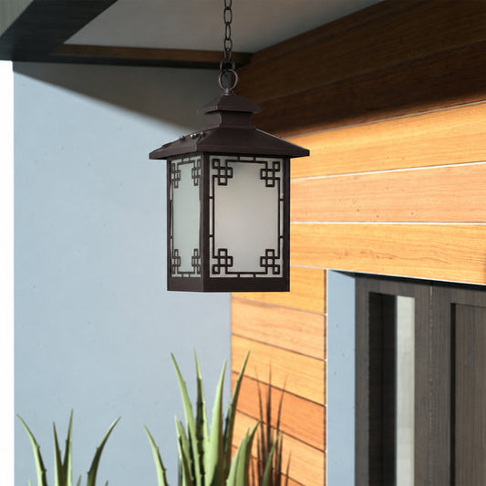 Modern black metal hanging lantern light enhancing contemporary entryway decor with elegant warm lighting.