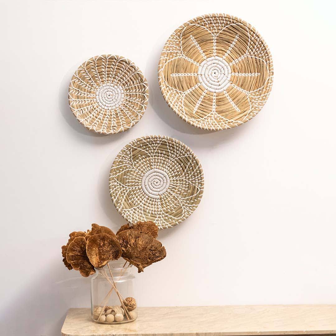 Handwoven seagrass wall basket decor set in natural beige with white accents arranged for elegant boho home wall styling.