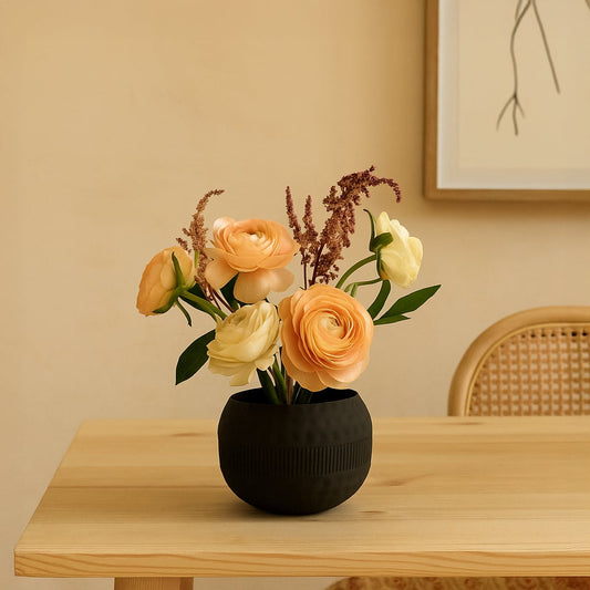 Modern black metal textured bowl decor styled on a warm tabletop adding an elegant accent to living room spaces.